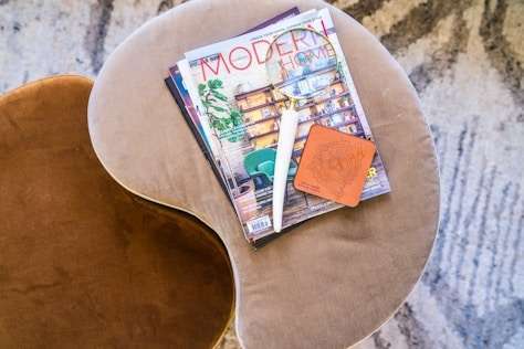 I will design a custom tailored magazine cover specifically for your brand